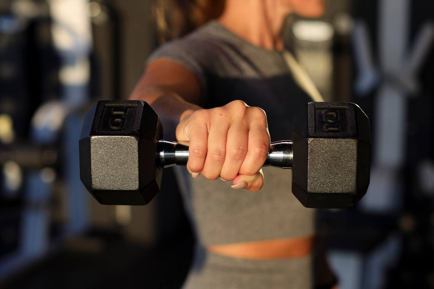 Woman holding a dumbbell during strength training